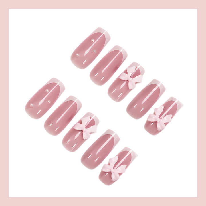 Nail art set with playful ribbon designs and elegant accents Stornfield