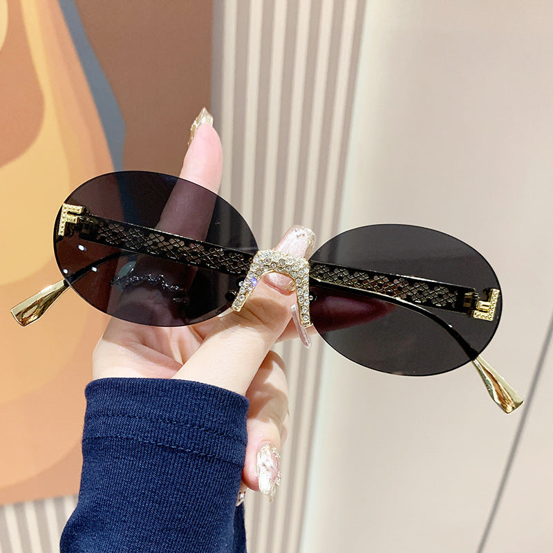 Women's sunglasses with glittering frame and oval lenses Stornfield