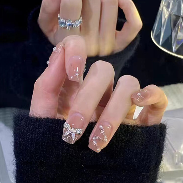 Artificial nails in an elegant design with 3D butterflies and glitter accents Stornfield