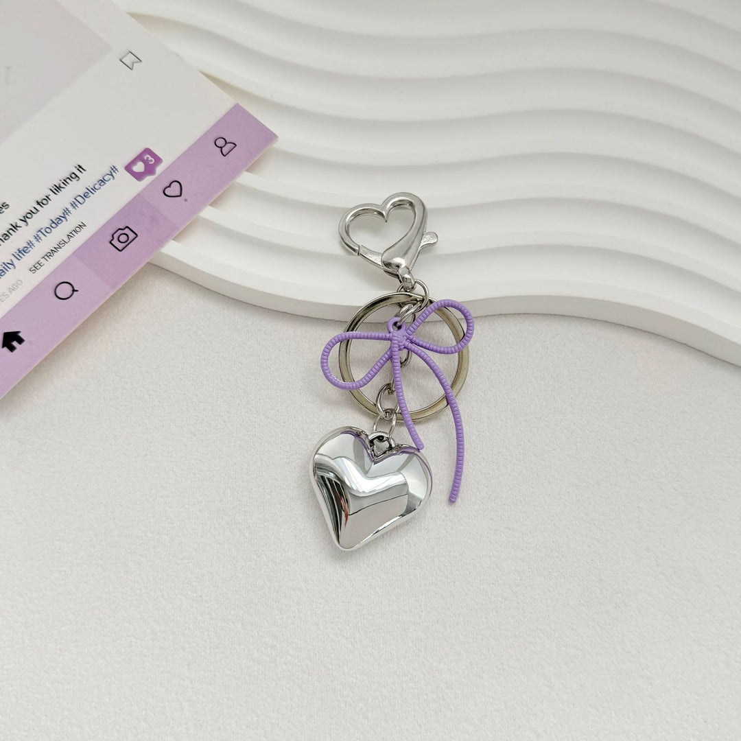 Heart-Shaped Metallic Keychain with Decorative Bow Stornfield
