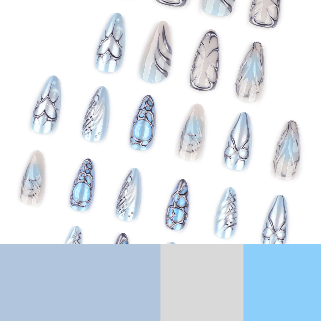 Artful stiletto nails with playful metallic details Stornfield