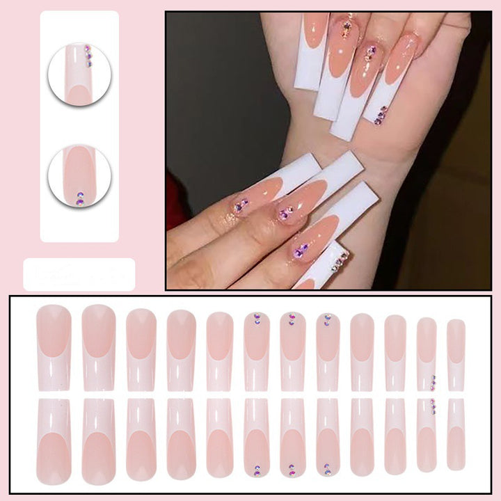 Nail set with elegant French tips and sparkling rhinestone embellishments Stornfield
