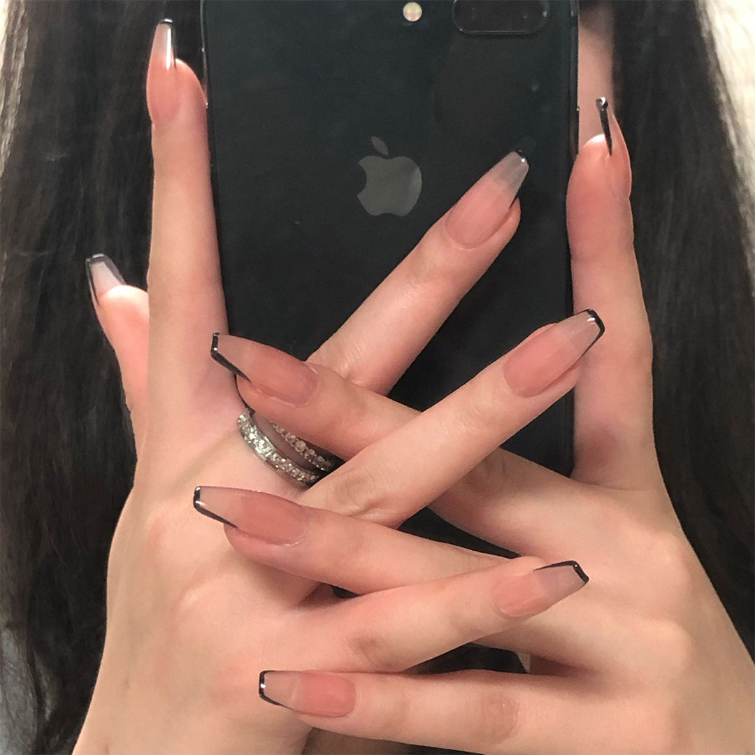 Artful stiletto nails with elegant black tip decoration Stornfield