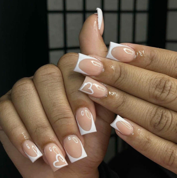Elegant Heart-Embellished Nail Art Design Stornfield