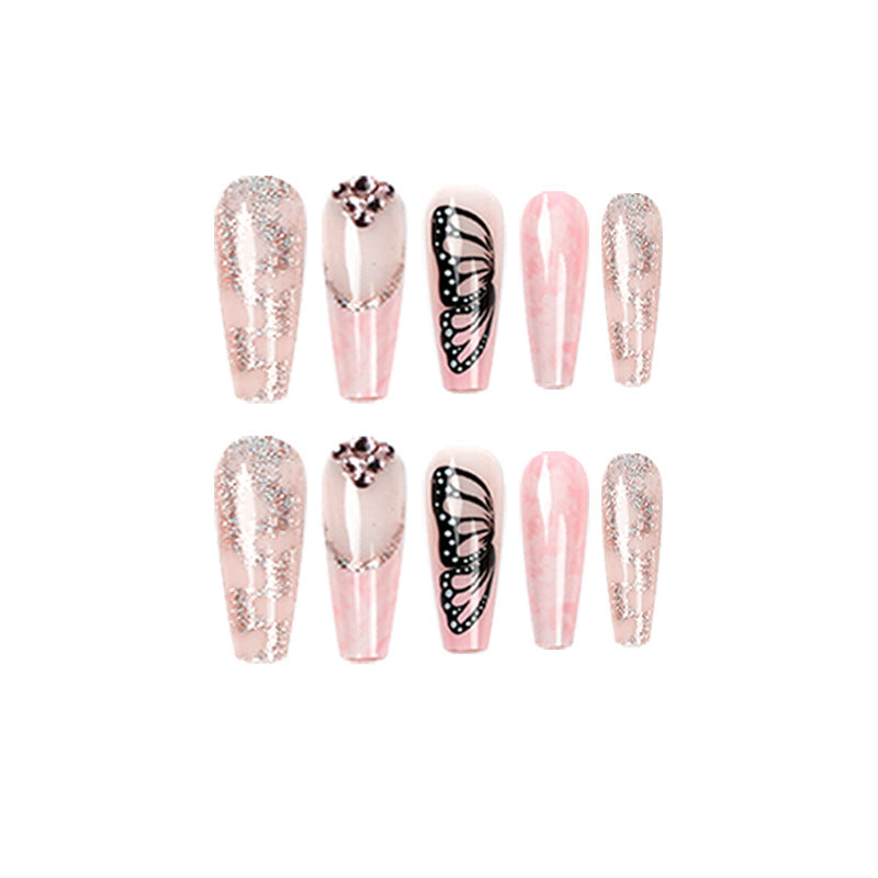Glamorous nail extensions with beautiful butterfly motifs and glitter accents Stornfield