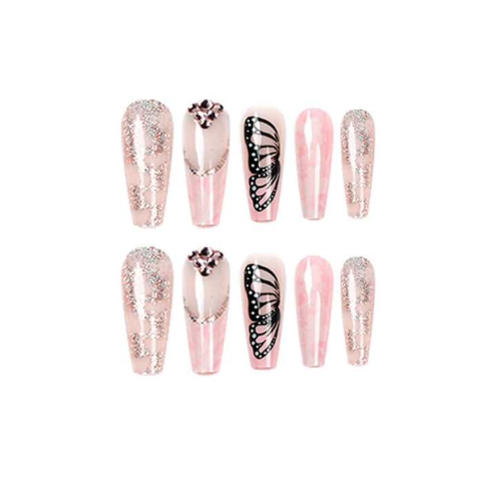 Glamorous nail extensions with beautiful butterfly motifs and glitter accents Stornfield