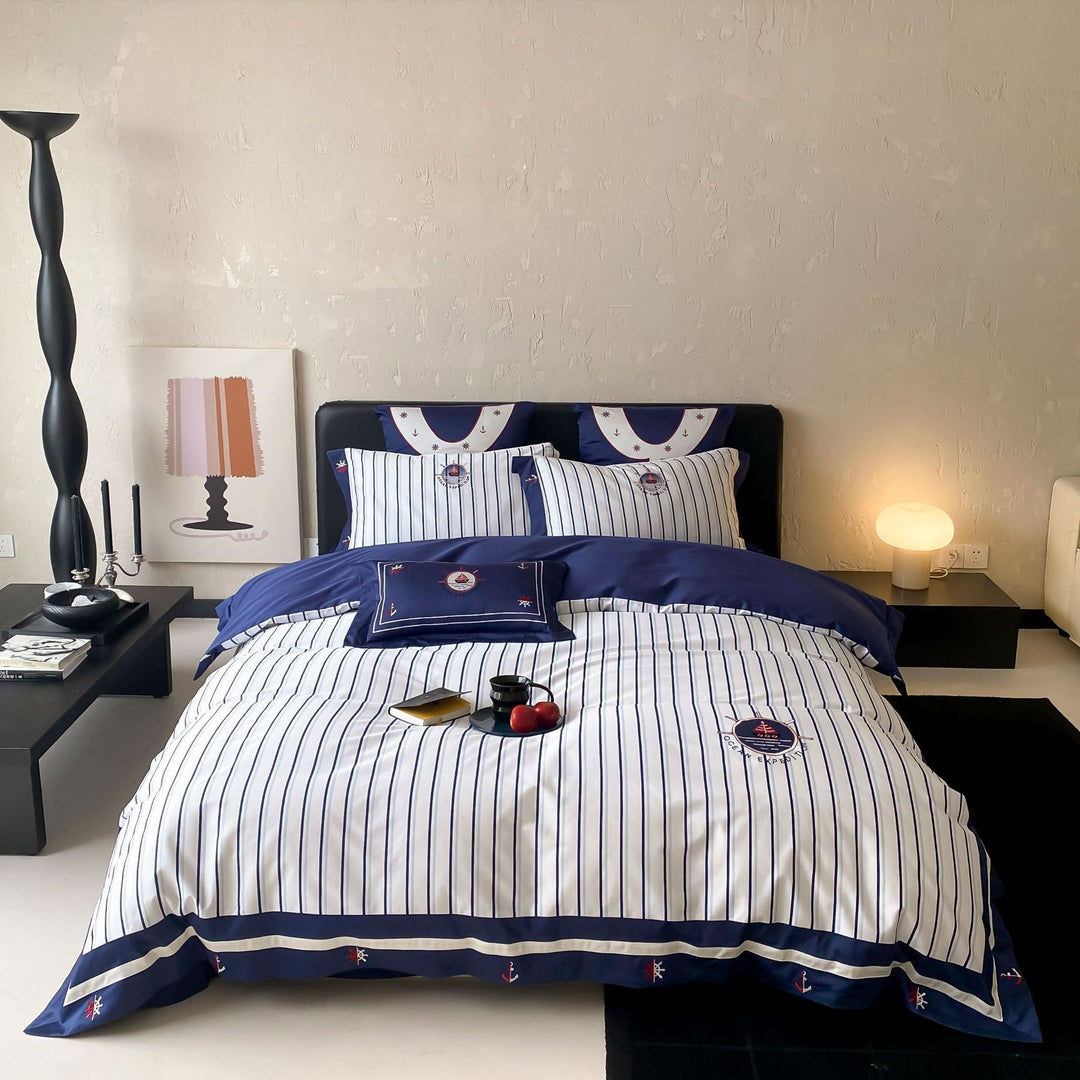Maritime cotton satin bedding set with fine stripes, nautical embroidery, and reversible pillow