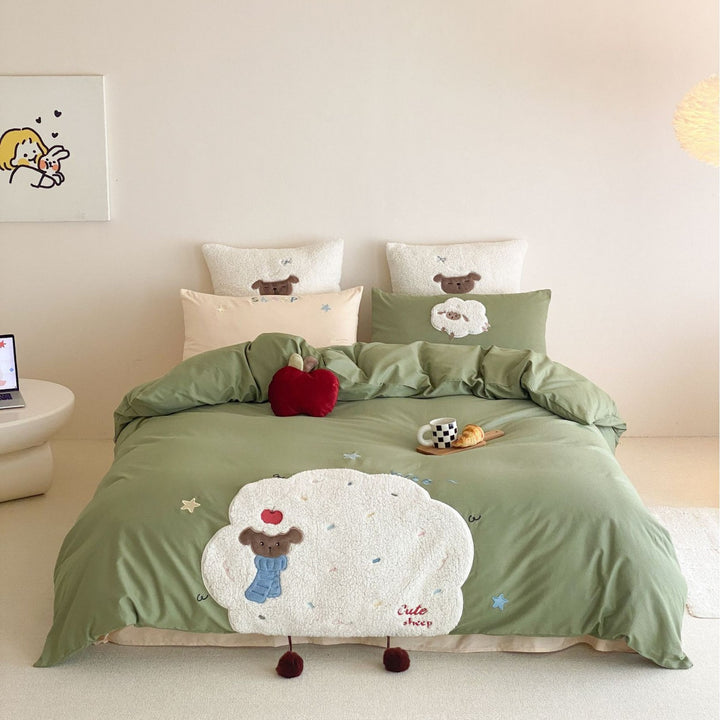Children's bedding set with appliquéd duck figure, embroidered details, and extra soft microfiber cover