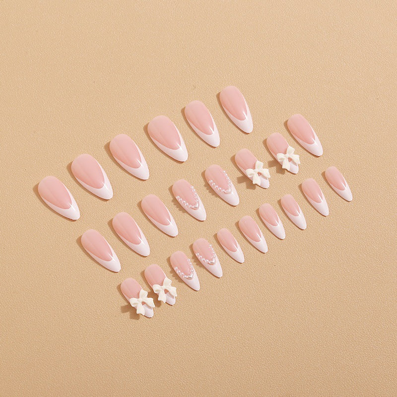 Artificial nail set with elegant bows and 3D decorations Stornfield