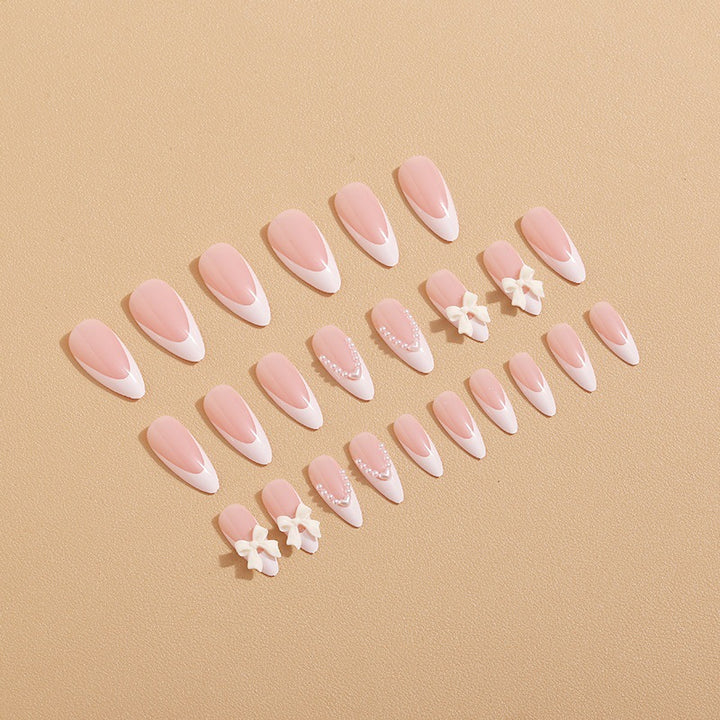 Artificial nail set with elegant bows and 3D decorations Stornfield