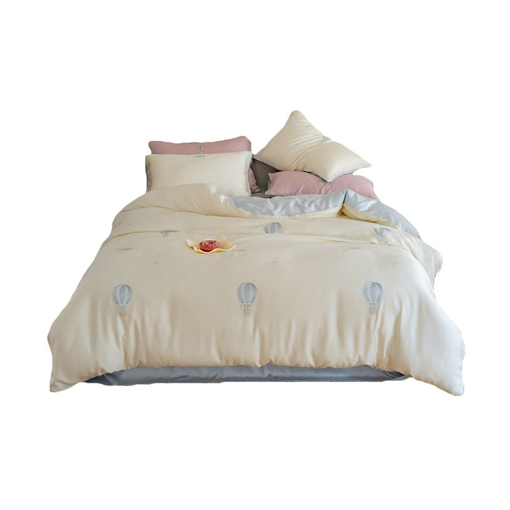 Luxurious satin bedding set with embroidered cherry motifs, reversible function and plush bunny pillow