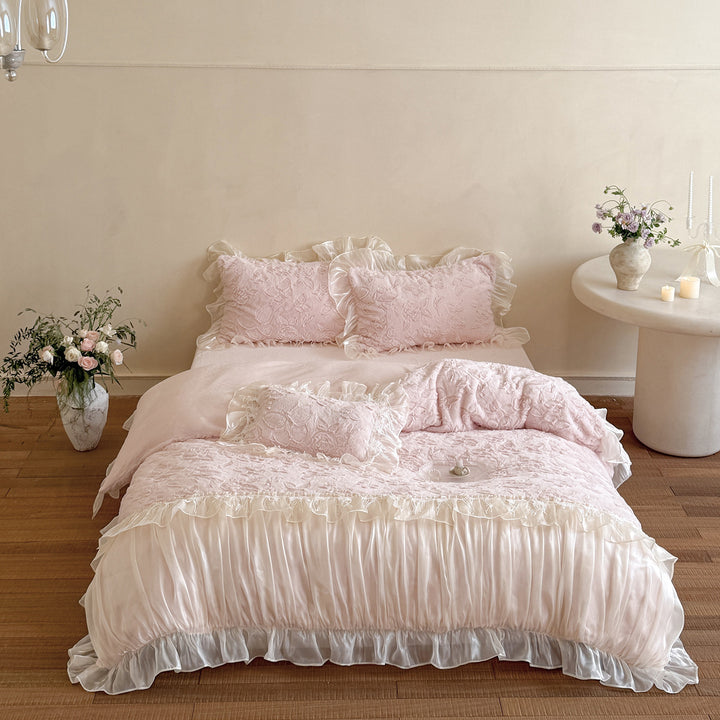 Ruffled satin bedding set with quilted floral relief