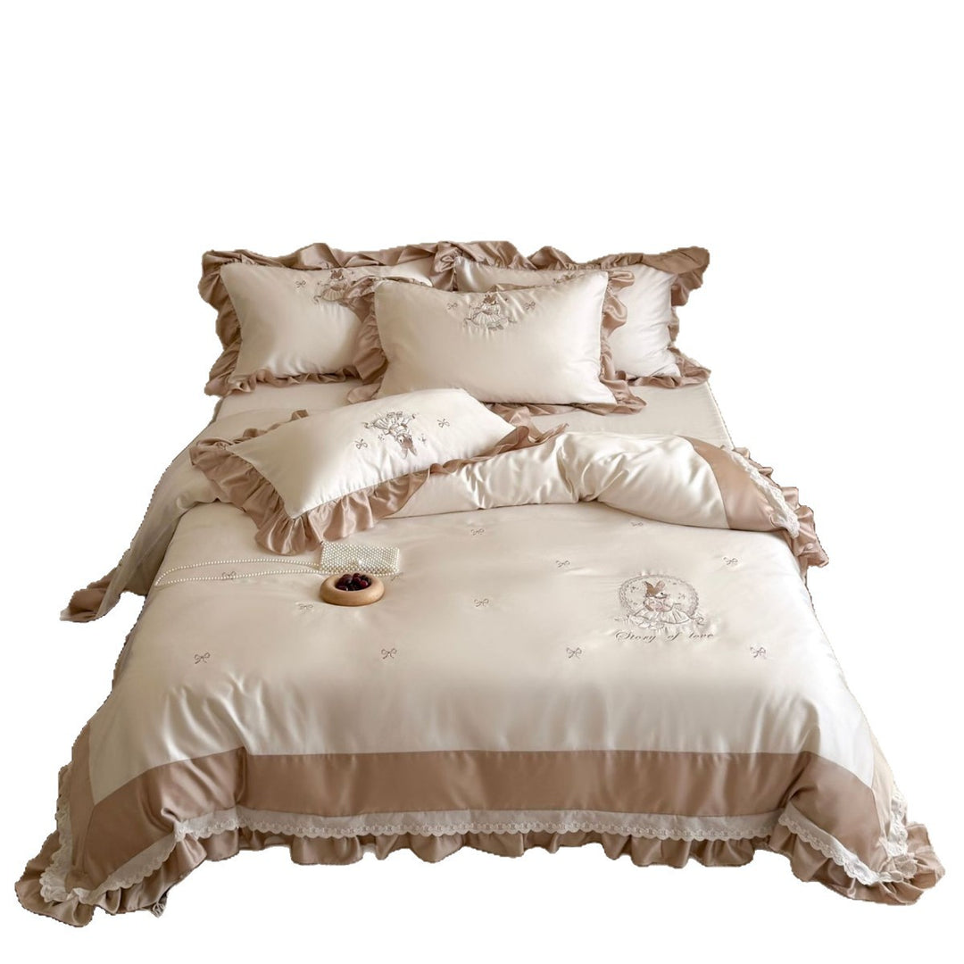 Playful cotton satin bedding set with ruffled edge and embroidered rabbit motif