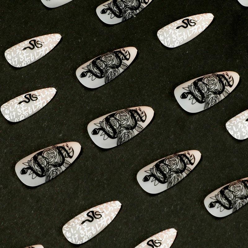 Artful nail extensions in elegant stiletto style with artistic floral and graphic designs Stornfield