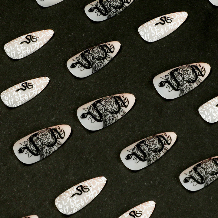 Artful nail extensions in elegant stiletto style with artistic floral and graphic designs Stornfield