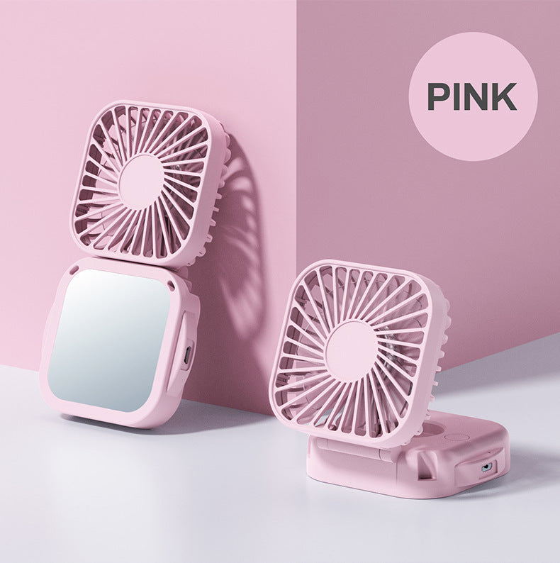 Unisex nan compact foldable clip on handheld desk fan with built in mirror adjustable tilt and USB rechargeable battery Stornfield