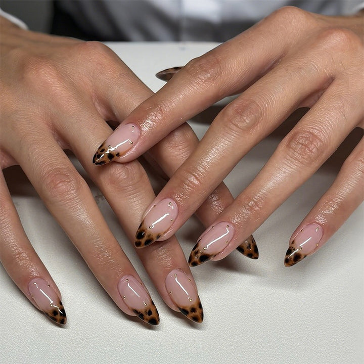 Nail art set with leopard pattern and glitter embellishments Stornfield