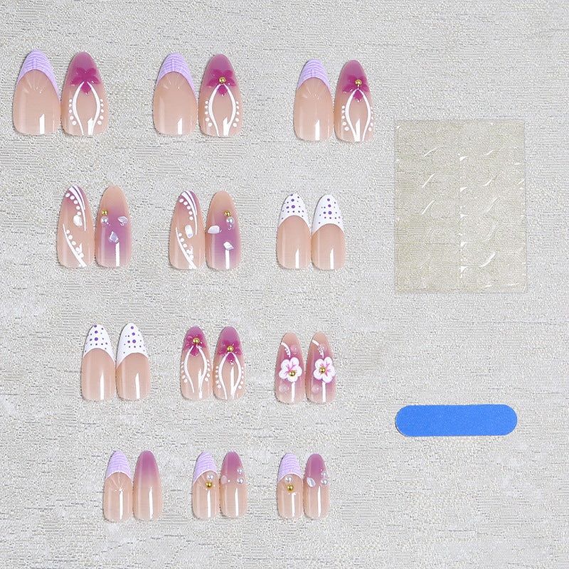 Artificial nail set with exotic floral and glitter accents Stornfield