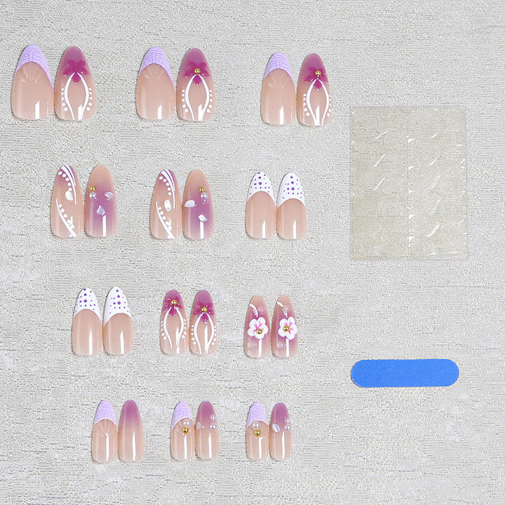 Artificial nail set with exotic floral and glitter accents Stornfield