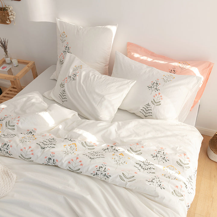 Embroidered cotton muslin bedding set with delicate flower appliqués and extra soft fitted sheet