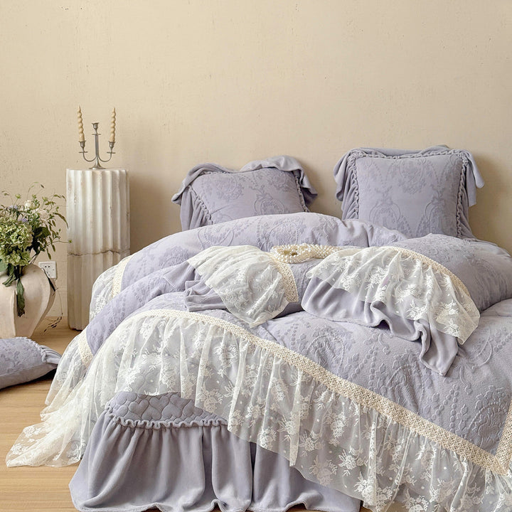 Romantic bedding set with lace trim, ruffle, and quilted blanket