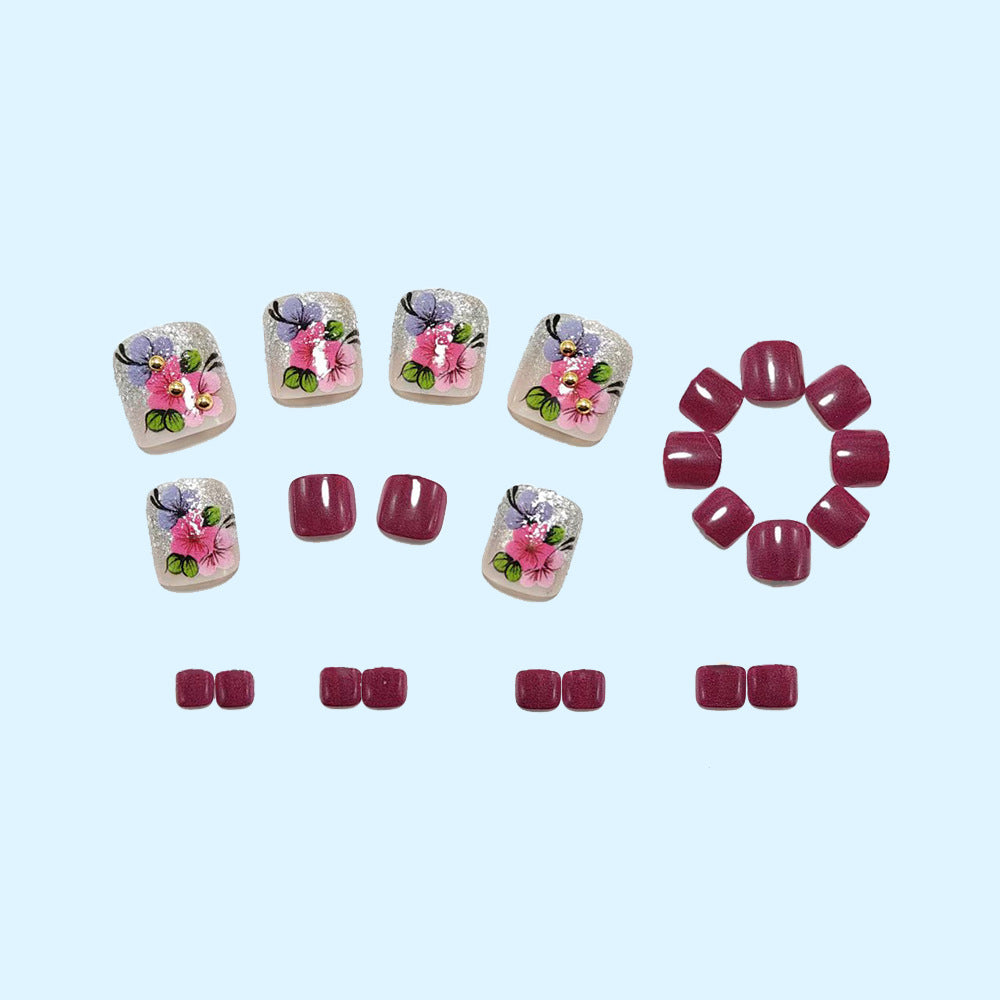 Artificial nails with floral motifs and glitter accents Stornfield