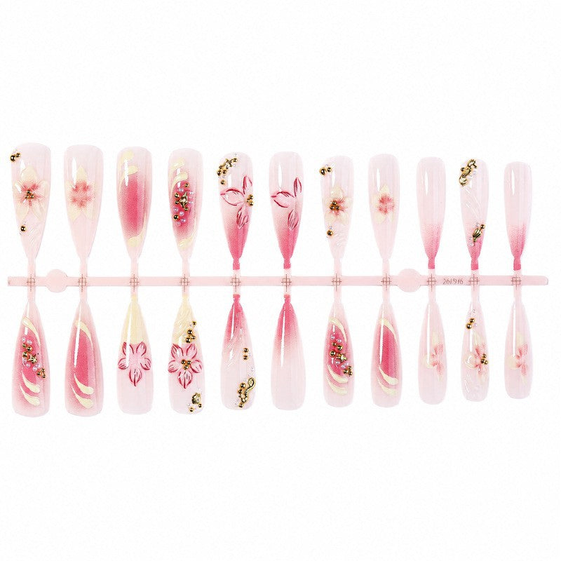 Nail art set with floral design and glitter accents Stornfield