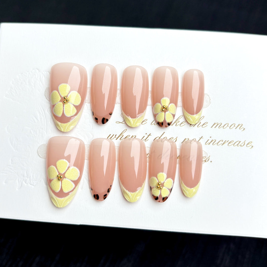 Artistic Press-On Nail Set with Floral Embellishments