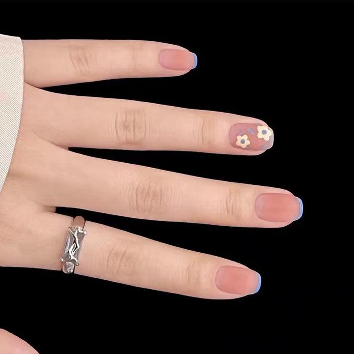 Creative nail design with floral accents Stornfield