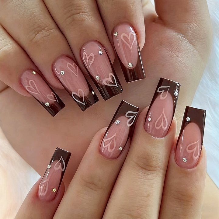 Elegant artificial nails with heart pattern and glitter accents Stornfield