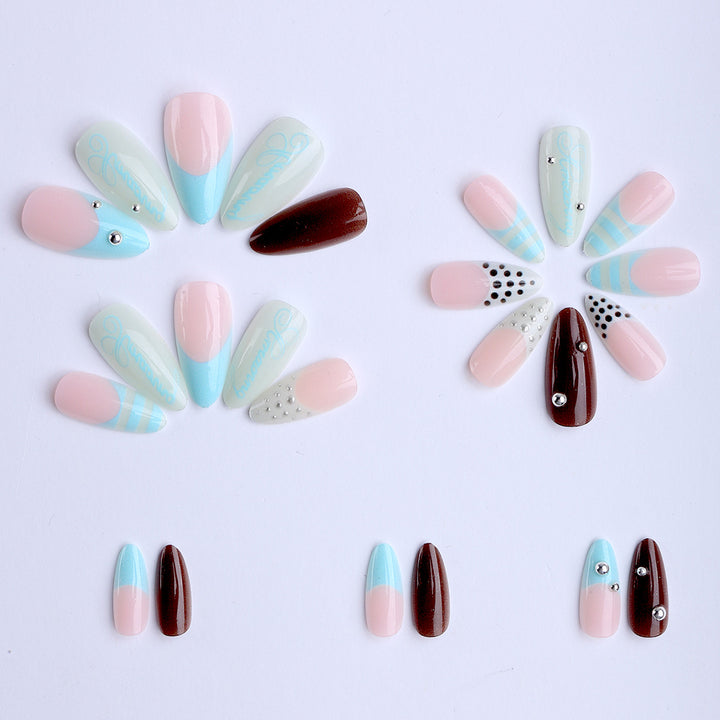Artificial stiletto nails with glamorous applications Stornfield