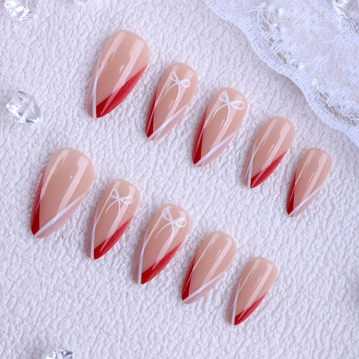 Artificial nails in elegant stiletto design with bow accents Stornfield