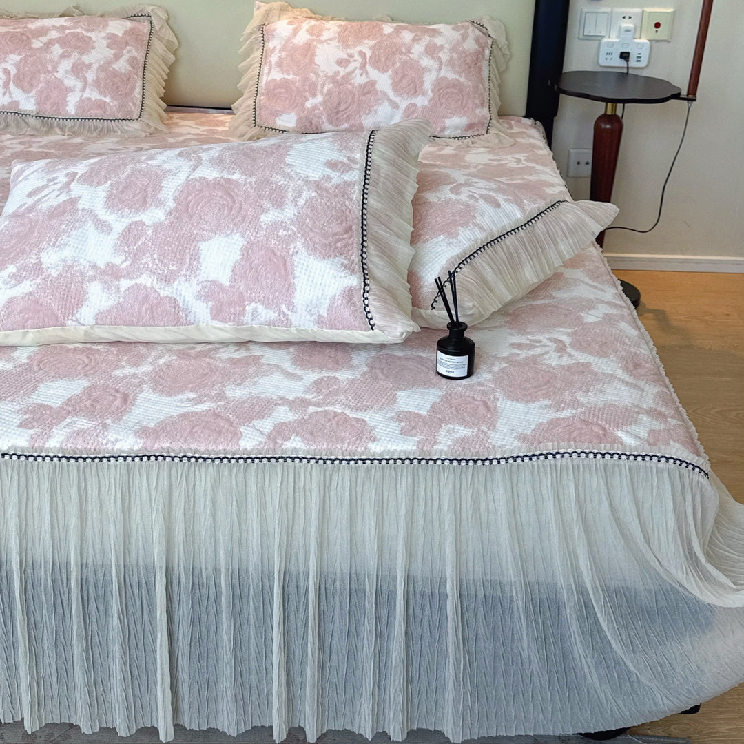 Quilted mattress and pillow set with butterfly motif and pleated bed ruffle