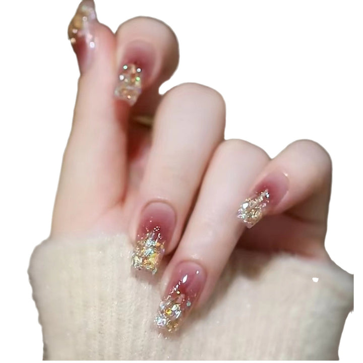 Stylish art false nails with heart design and glitter Stornfield