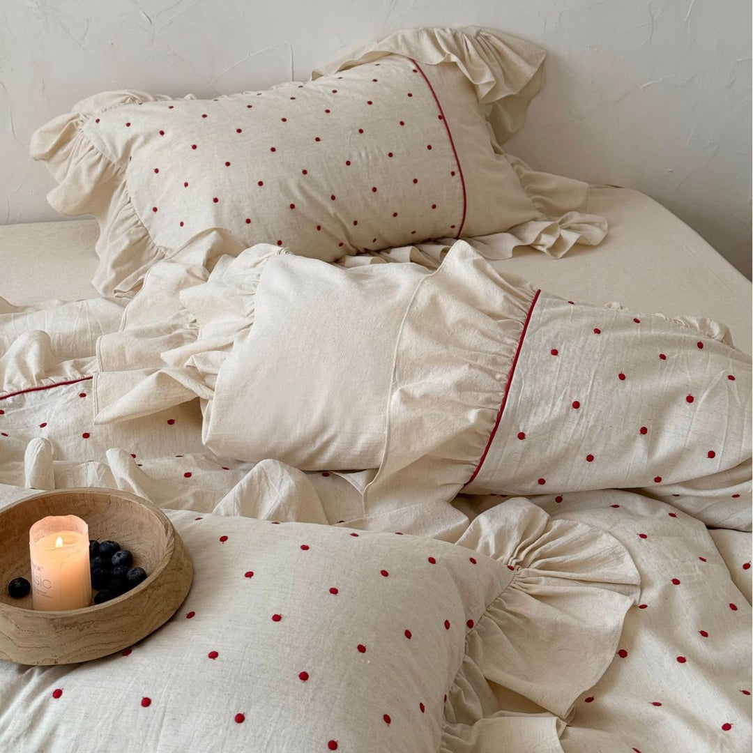 Romantic bedding set with ruffles and delicate dot embroidery