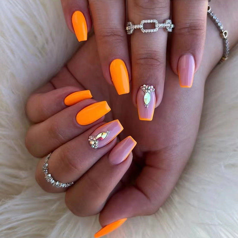 Acrylic nail set with trendy neon colors and rhinestone accents Stornfield