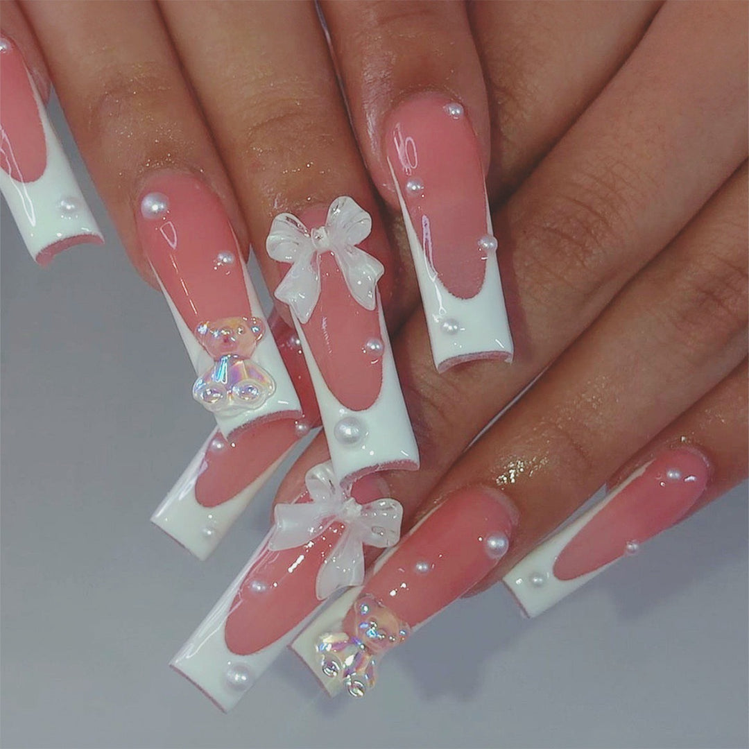 Artificial nail set with elegant 3D bows and glitter accents Stornfield