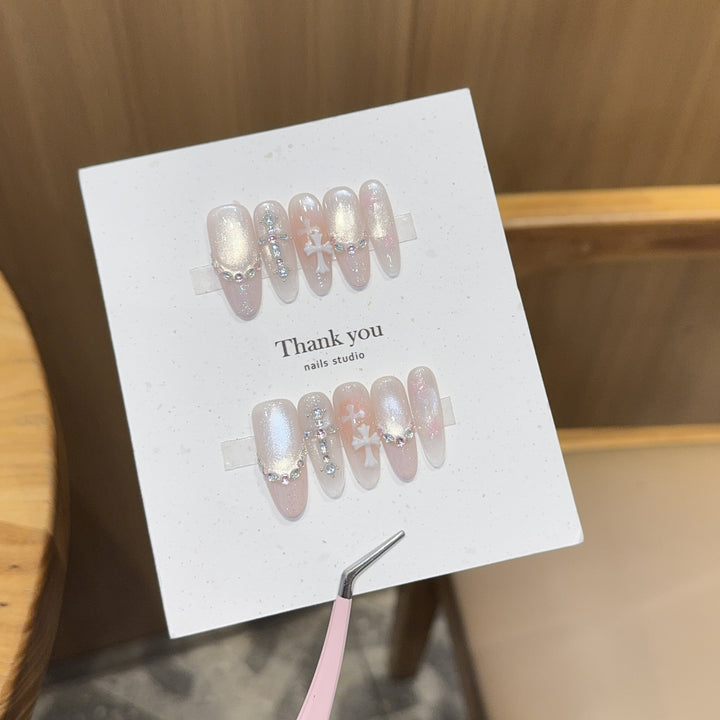 Artificial nails with sparkling rhinestone and glitter effects Stornfield