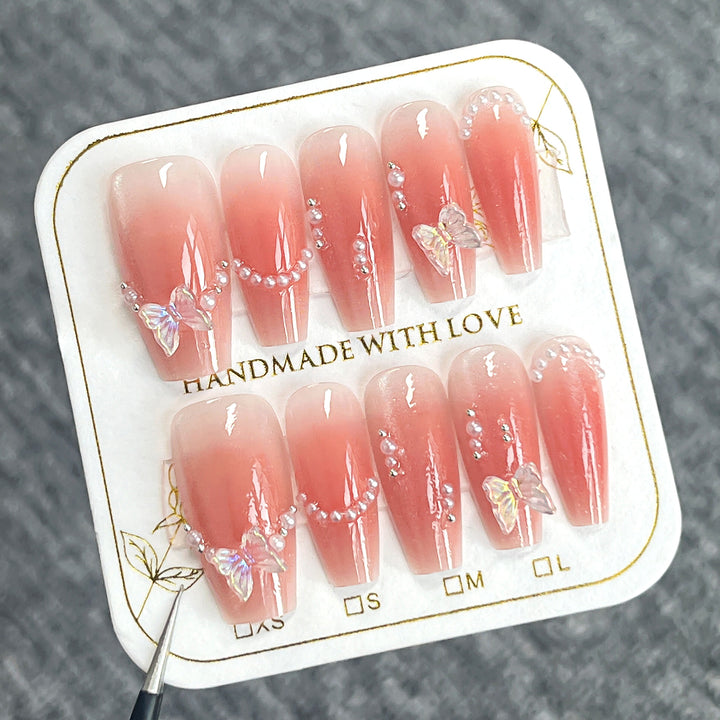 Glamorous artificial nails with elegant bow and butterfly design Stornfield