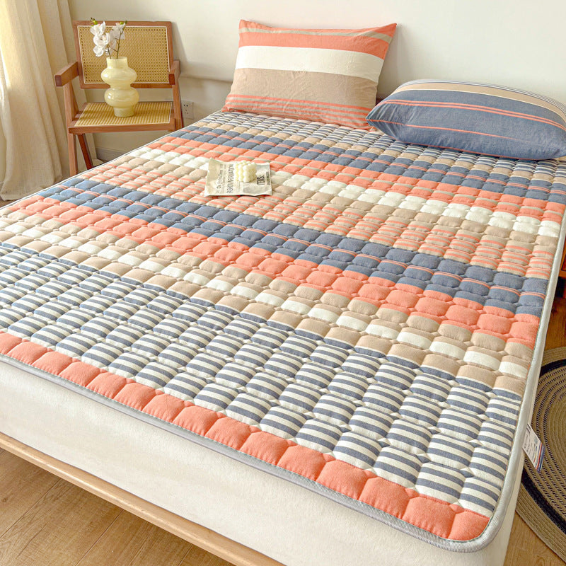 Padded mattress protector-topper with quilting and non-slip underside