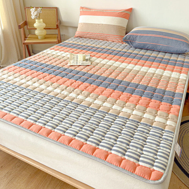 Padded mattress protector-topper with quilting and non-slip underside