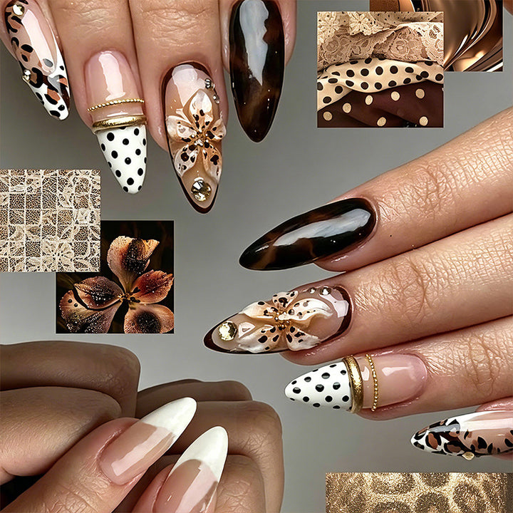 Artificial nail set with glamorous floral designs and creative glitter accents Stornfield