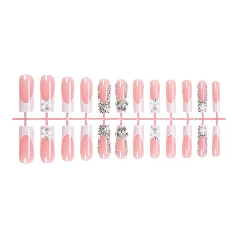 Artificial nail set with shimmering rhinestone decorations and floral design Stornfield