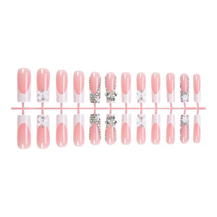 Artificial nail set with shimmering rhinestone decorations and floral design Stornfield