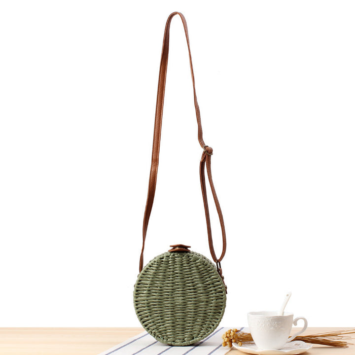 Round basket bag with leather accents Stornfield
