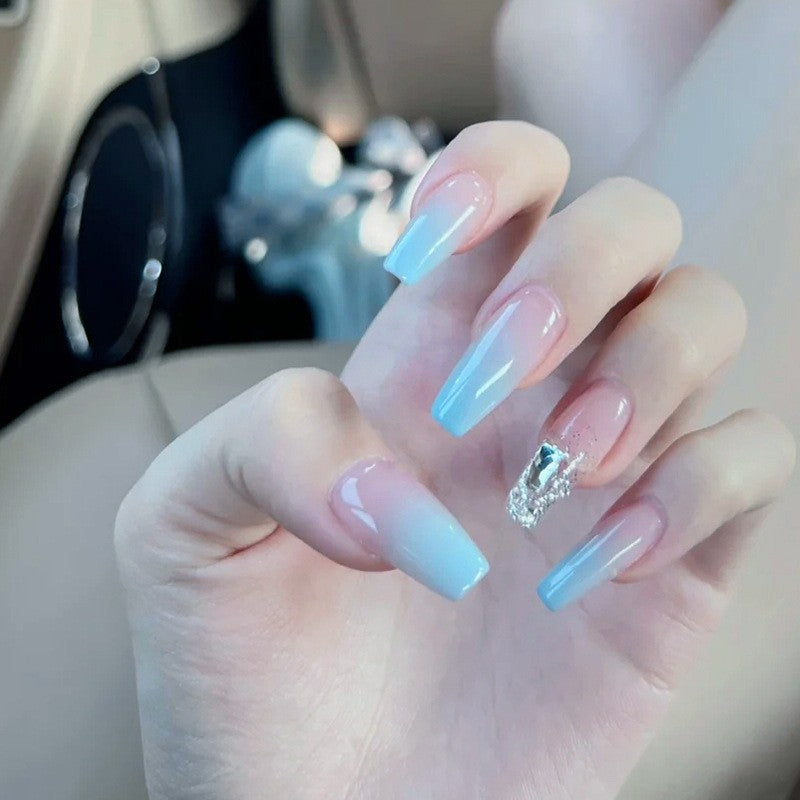 Nail set with elegant ombre and glitter accents Stornfield