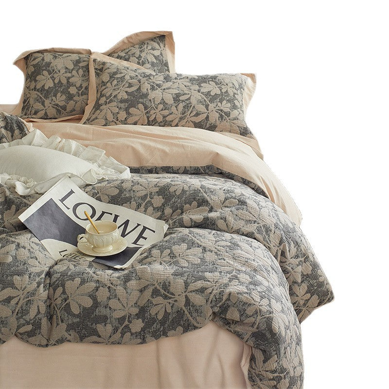 Quilted bed set with floral jacquard design and light thermal padding