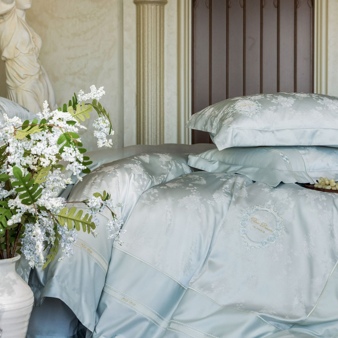 Luxurious satin bedding set with embroidered medallions and elegant quilting