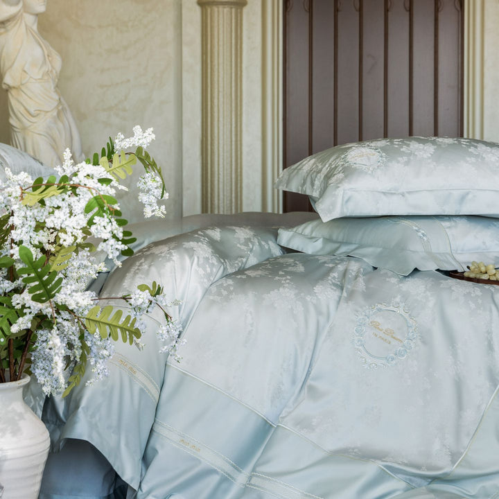 Luxurious satin bedding set with embroidered medallions and elegant quilting