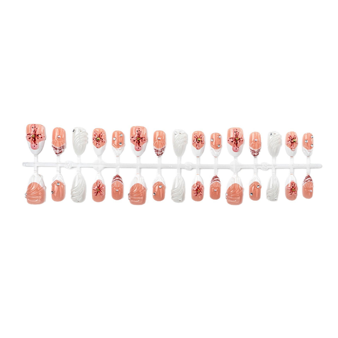 Artificial nails with handcrafted flower and glitter elements Stornfield